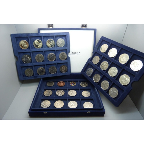 912 - A collection of commemorative coins, boxed, (36)