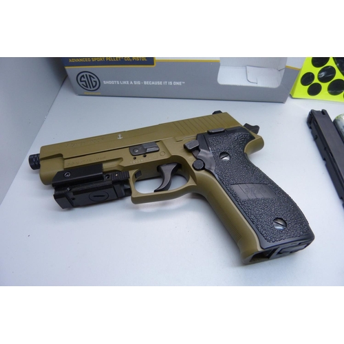 925 - A Sig P226 CO pistol with cannisters and pellets, semi-auto, with blow back action, targets and box,... 