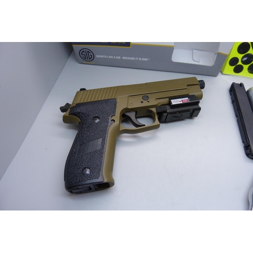 925 - A Sig P226 CO pistol with cannisters and pellets, semi-auto, with blow back action, targets and box,... 