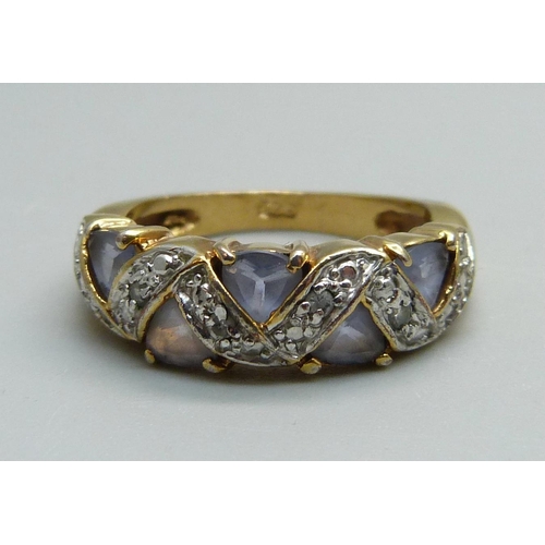 954 - A silver gilt and blue stone ring, Q