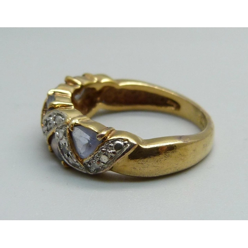 954 - A silver gilt and blue stone ring, Q