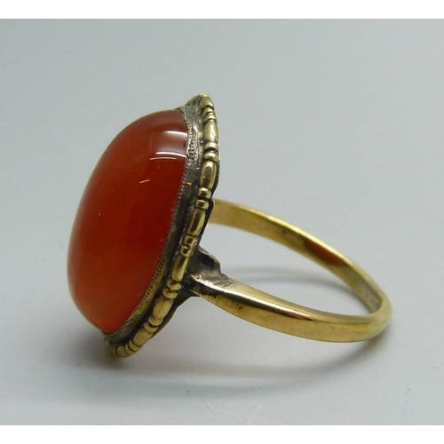 955 - A silver gilt and orange cabochon ring, N