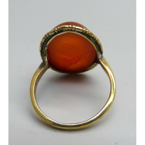 955 - A silver gilt and orange cabochon ring, N