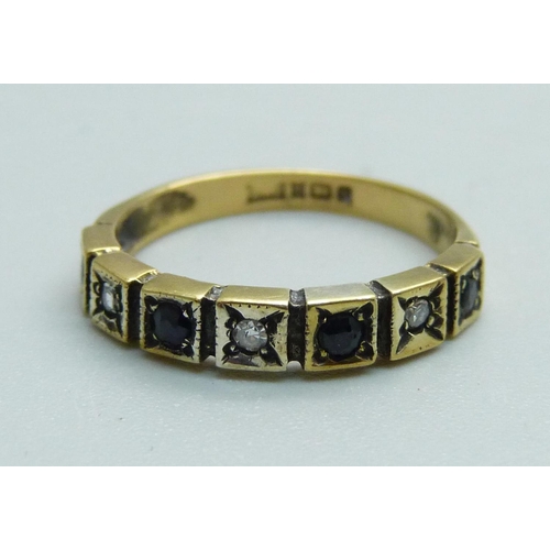 959 - A seven stone sapphire and diamond ring, J