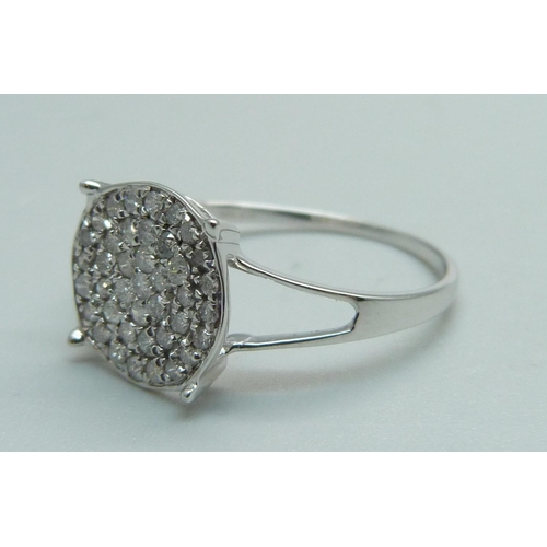 970 - A 9ct white gold forty-stone diamond cluster ring, approximately .50 carat weight, with certificate,... 