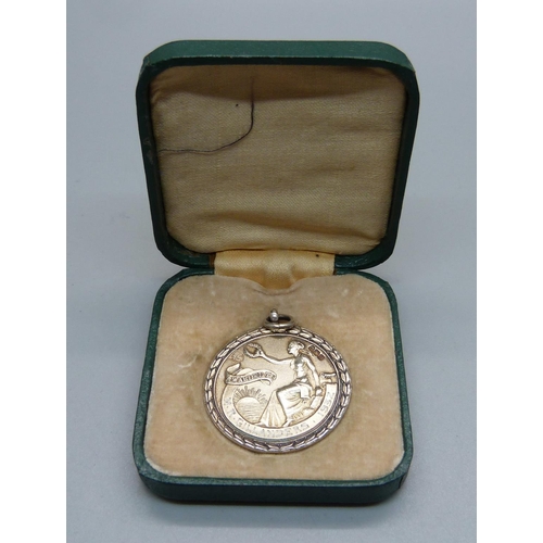 987 - A cased silver Royal Life Saving Society medal, with inscription dated 1932