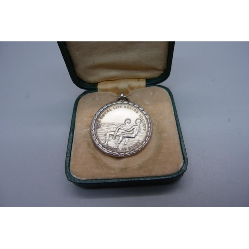 987 - A cased silver Royal Life Saving Society medal, with inscription dated 1932