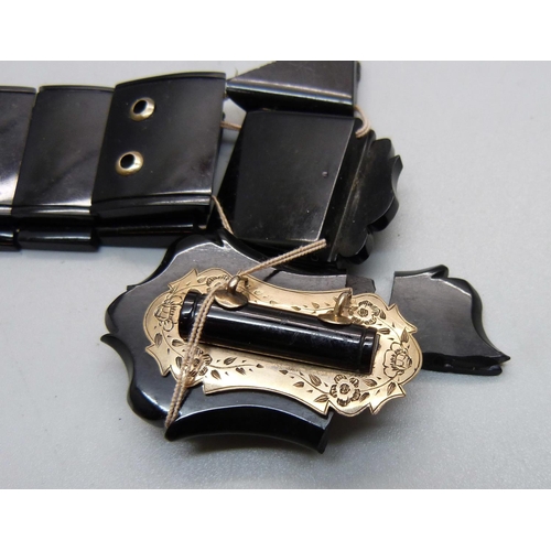 991 - A jet bracelet with yellow metal buckle detail, a/f