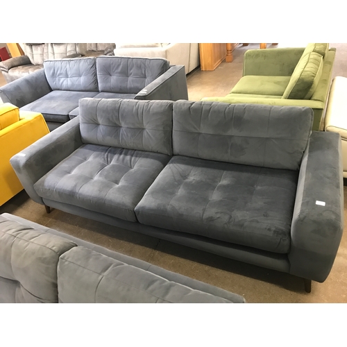 1468 - A slate velvet pinched back four seater sofa