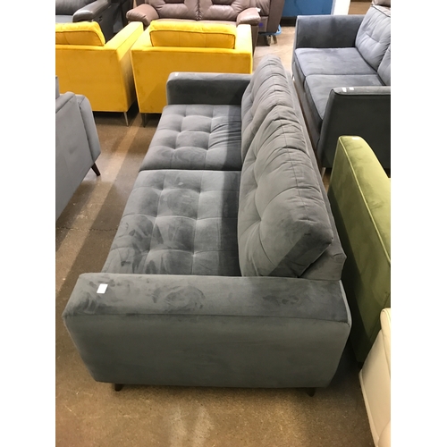 1468 - A slate velvet pinched back four seater sofa