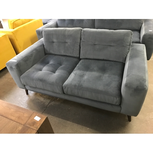 1469 - A slate velvet pinched back two seater sofa