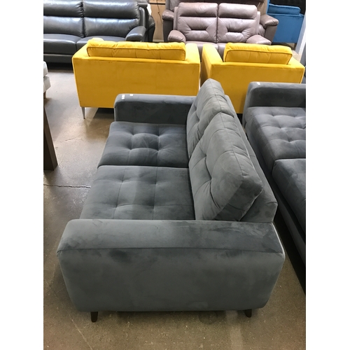 1469 - A slate velvet pinched back two seater sofa