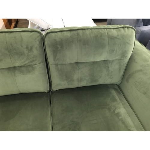 1473 - A moss green velvet two seater sofa