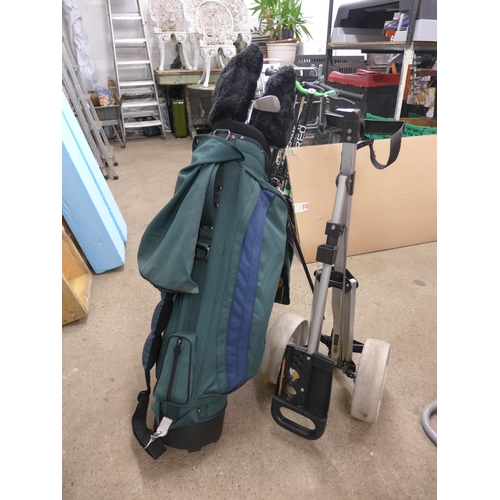 2380 - Golf bag and set of clubs and trolley, containing mostly Flowline golf clubs