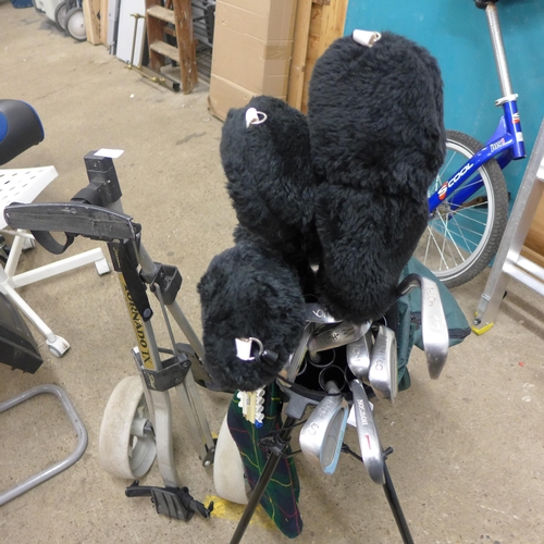 2380 - Golf bag and set of clubs and trolley, containing mostly Flowline golf clubs