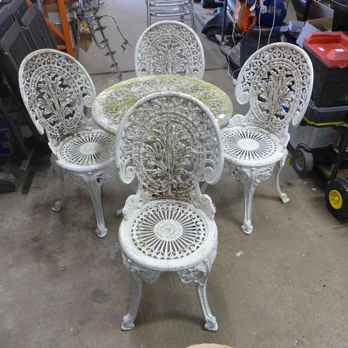 2394 - Cast aluminium table and four chairs