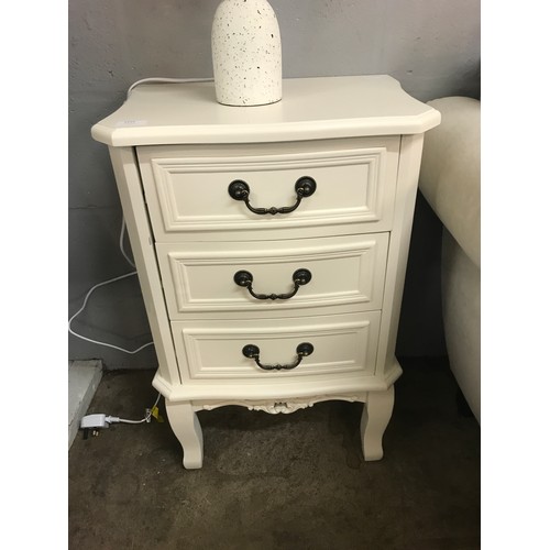 1319 - A three drawer white bedside chest