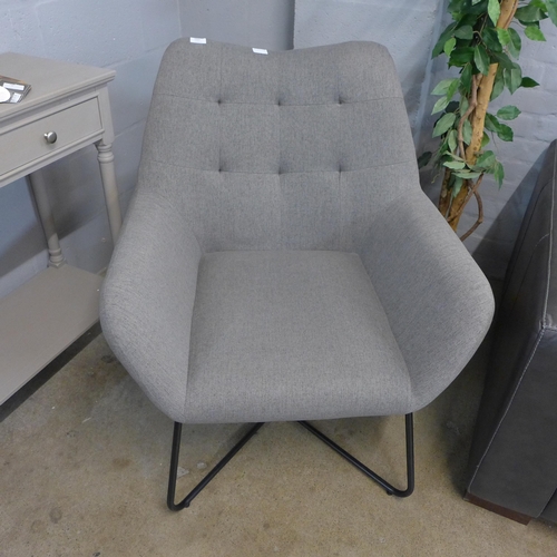 1322 - A light grey upholstered pinched back armchair