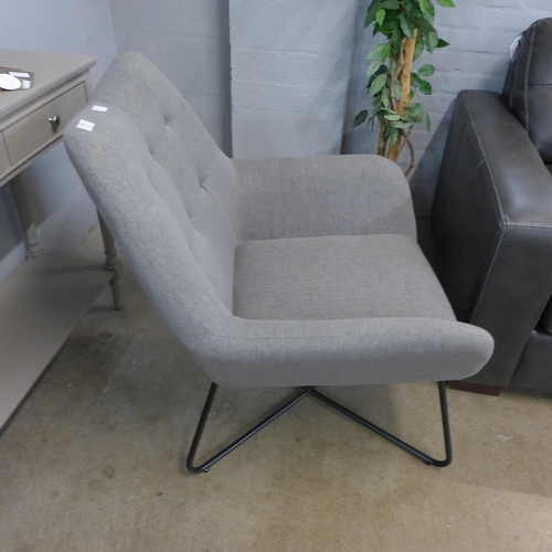 1322 - A light grey upholstered pinched back armchair