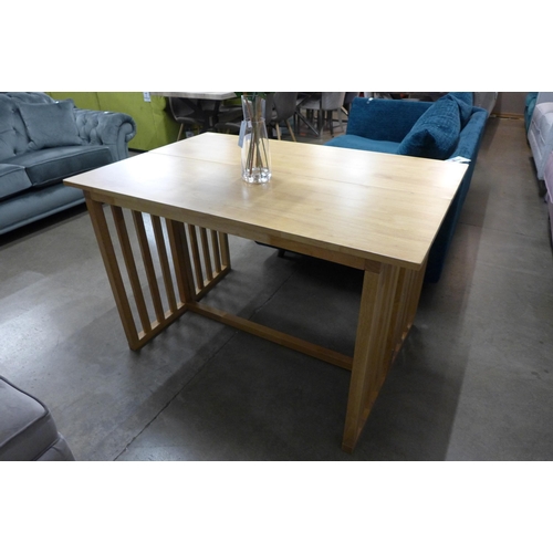 1356 - A light oak metamorphic dining table/console table, slight chip