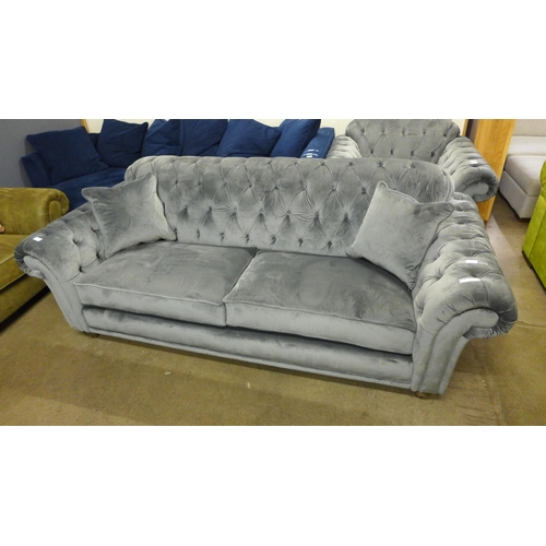 1368 - A Bordeaux four seater button back 'steel' velvet sofa - damaged button