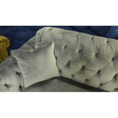 1368 - A Bordeaux four seater button back 'steel' velvet sofa - damaged button