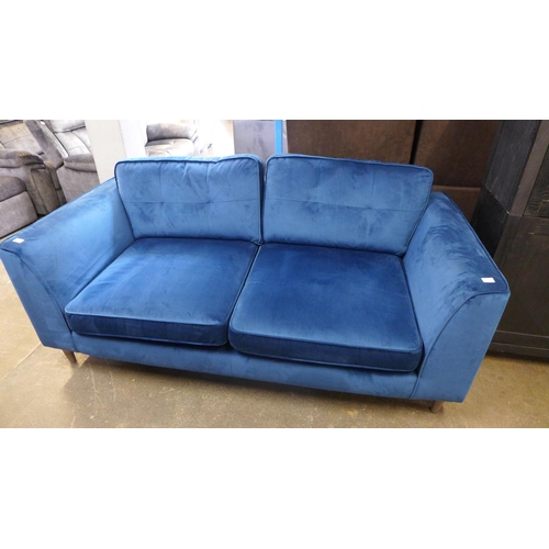 1436A - A blue velvet pinched back 2.5 seater sofa