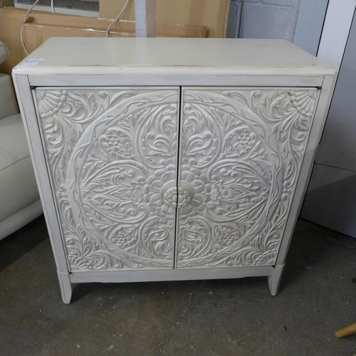 1458 - A Pike and Main white painted carved two door sideboard