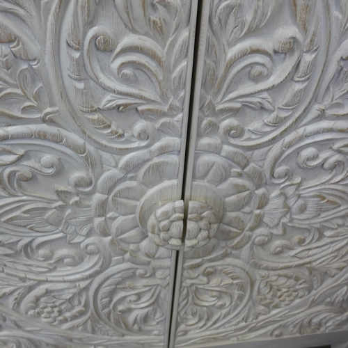 1458 - A Pike and Main white painted carved two door sideboard