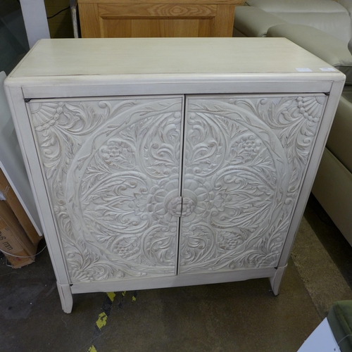 1464 - A Pike and Main white painted carved two door sideboard