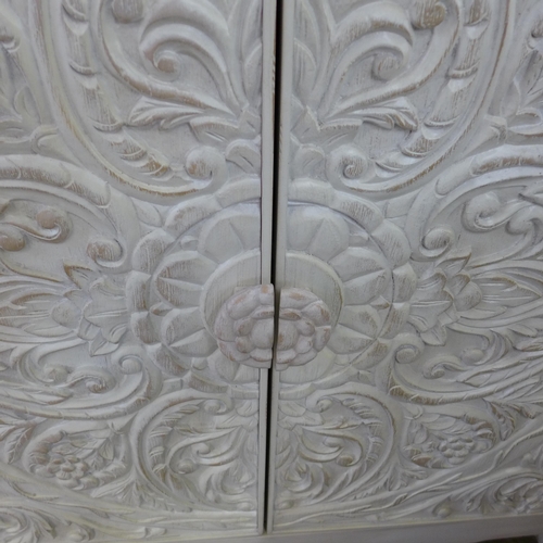 1464 - A Pike and Main white painted carved two door sideboard