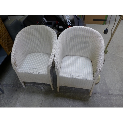 1522 - A pair of white painted rattan tub chairs and a floor standing lamp