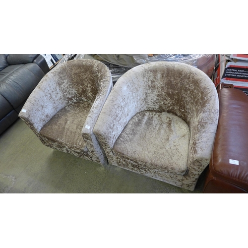 1552 - A pair of mink crushed velvet upholstered tub chairs