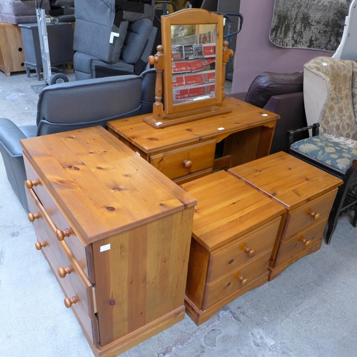 1555 - A quantity of dark stained pine. a dresser with mirror, a pair of bedside chests and a chest of thre... 