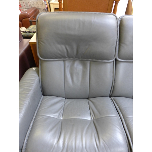 1558 - A grey leather pushback reclining two seater sofa