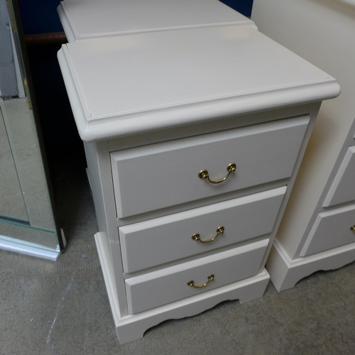 1498 - A cream painted pine six drawer dressing table with mirror, upholstered stool and a pair of three dr... 