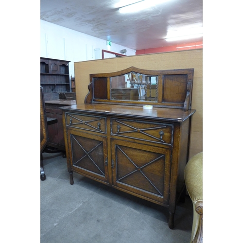 100 - An early 20th Century oak mirrorback sideboard