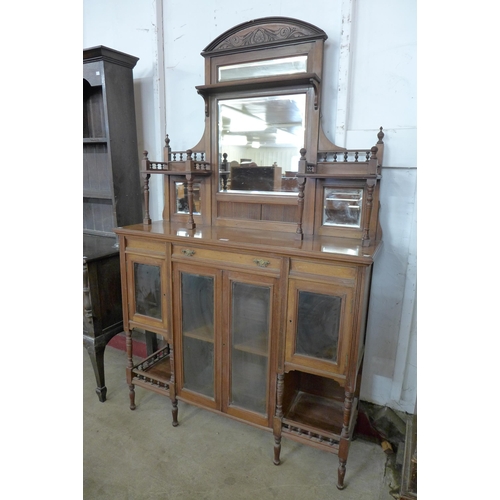 103 - A late Victorian walnut mirrorback side cabinet