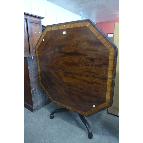 106 - A George IV mahogany octagonal tilt centre table