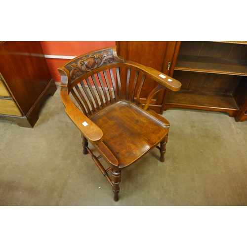 11 - A Victorian carved oak Captain's desk chair