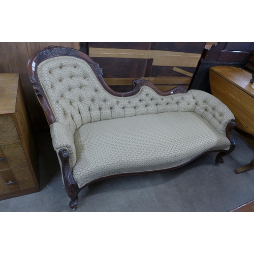 111 - A Victorian style carved mahogany and fabric upholstered chaise longue