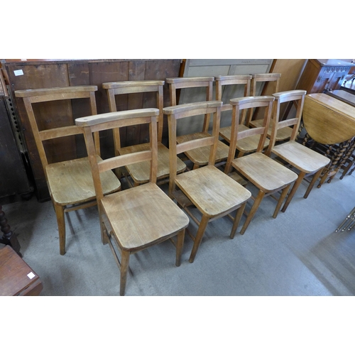 117 - A set of nine early 20th Century beech chapel chairs