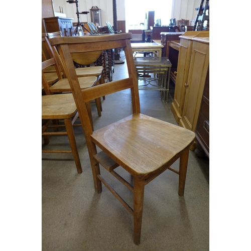 117 - A set of nine early 20th Century beech chapel chairs