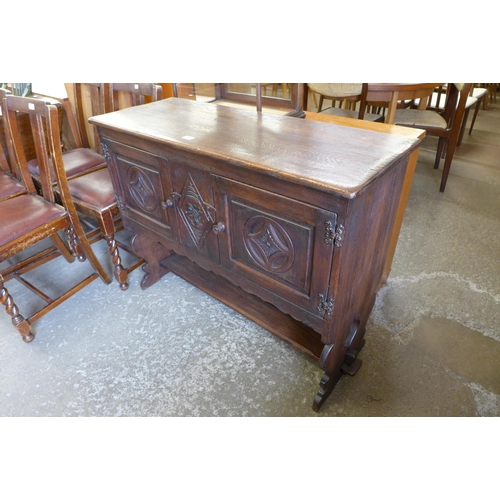 132 - A 17th Century style carved oak credence cupboard