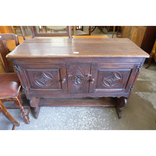 132 - A 17th Century style carved oak credence cupboard