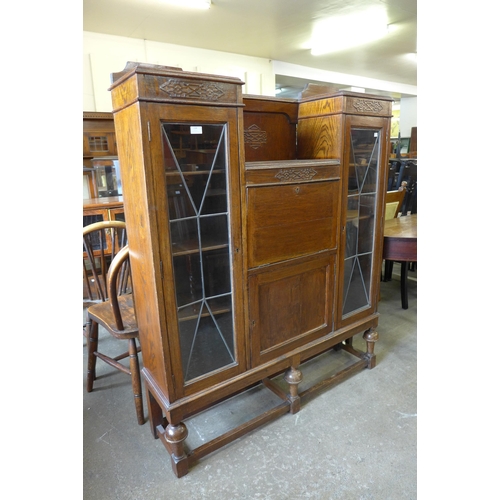 134 - A carved oak side by side bureau bookcase