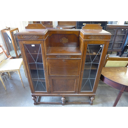 134 - A carved oak side by side bureau bookcase