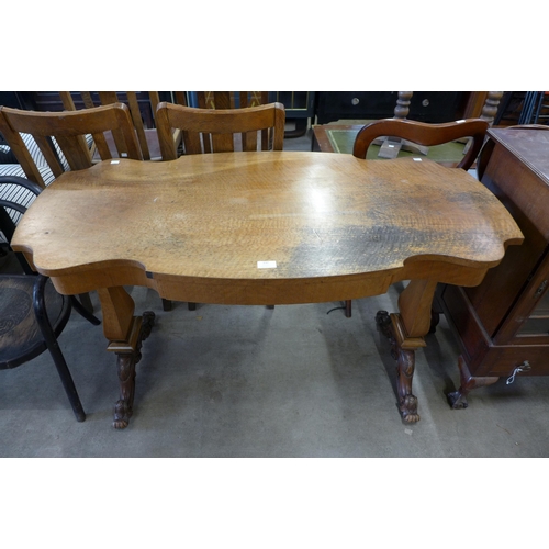 137 - A Victorian style walnut single drawer library table