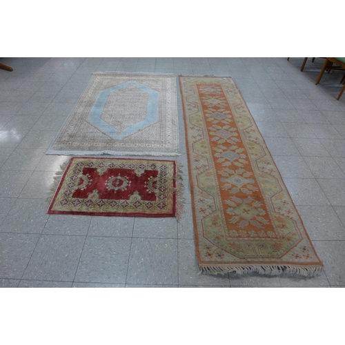 147 - Three assorted rugs