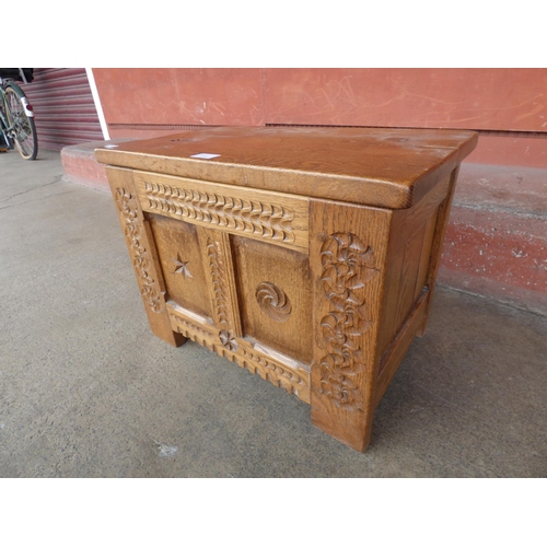 150B - A small 17th Century style carved oak blanket box